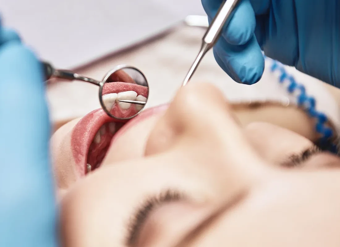 A dentist at Marconi Dental Group caring for a patient